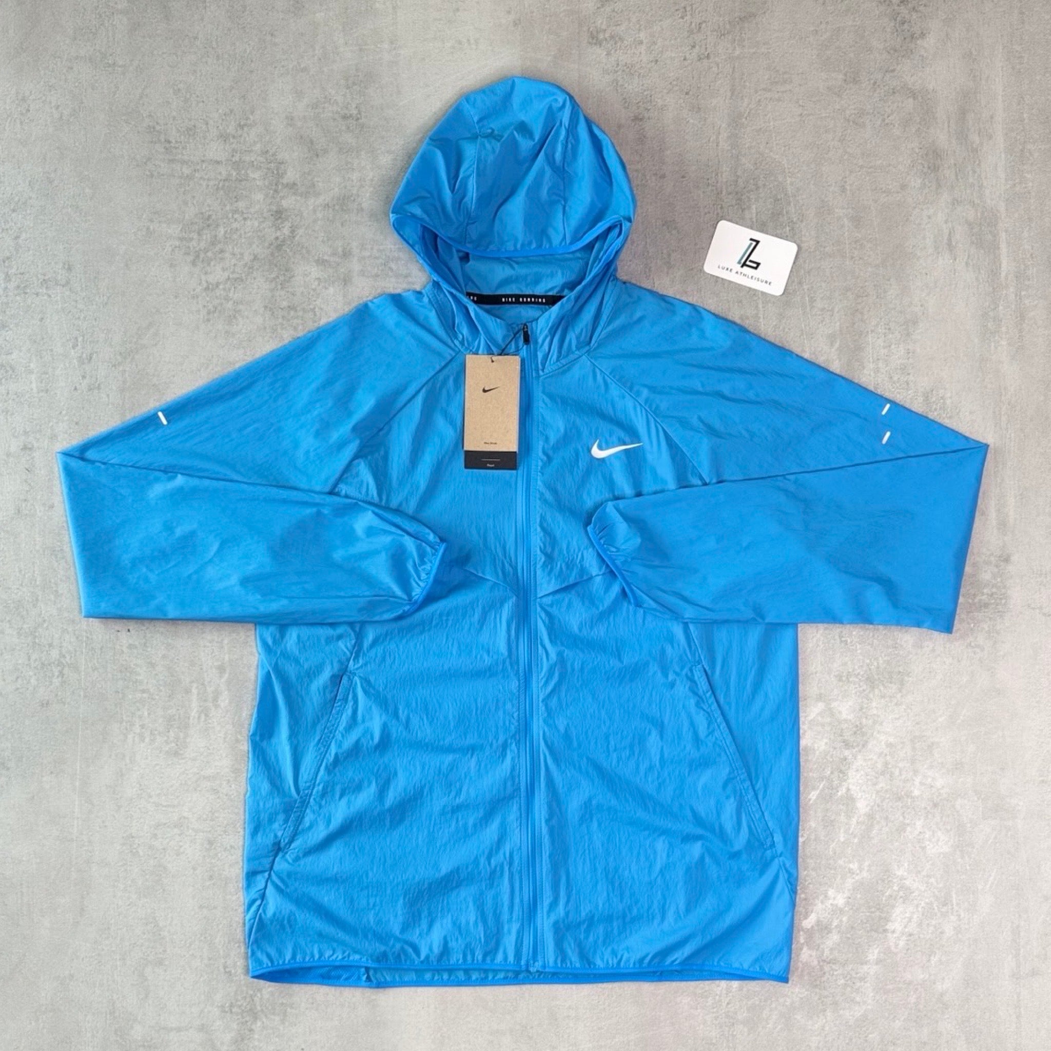 NIKE STRIDE WINDBREAKER ‘BLUE HERO’